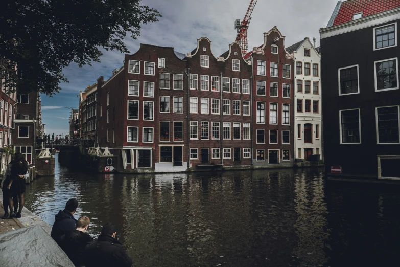 the view of some buildings from a dock