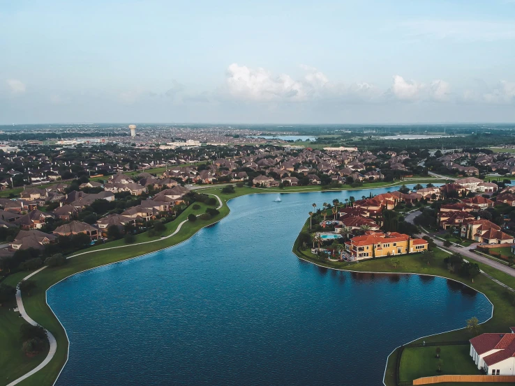 an aerial view of a river running through a city