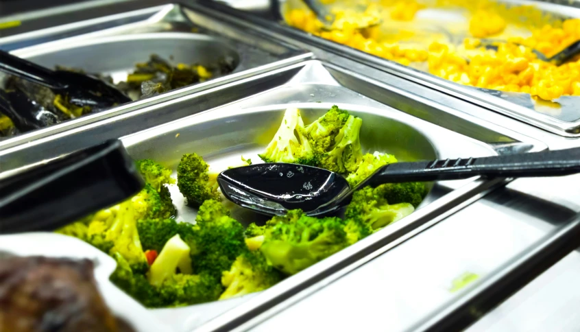 a table full of food and utensils with some dishes