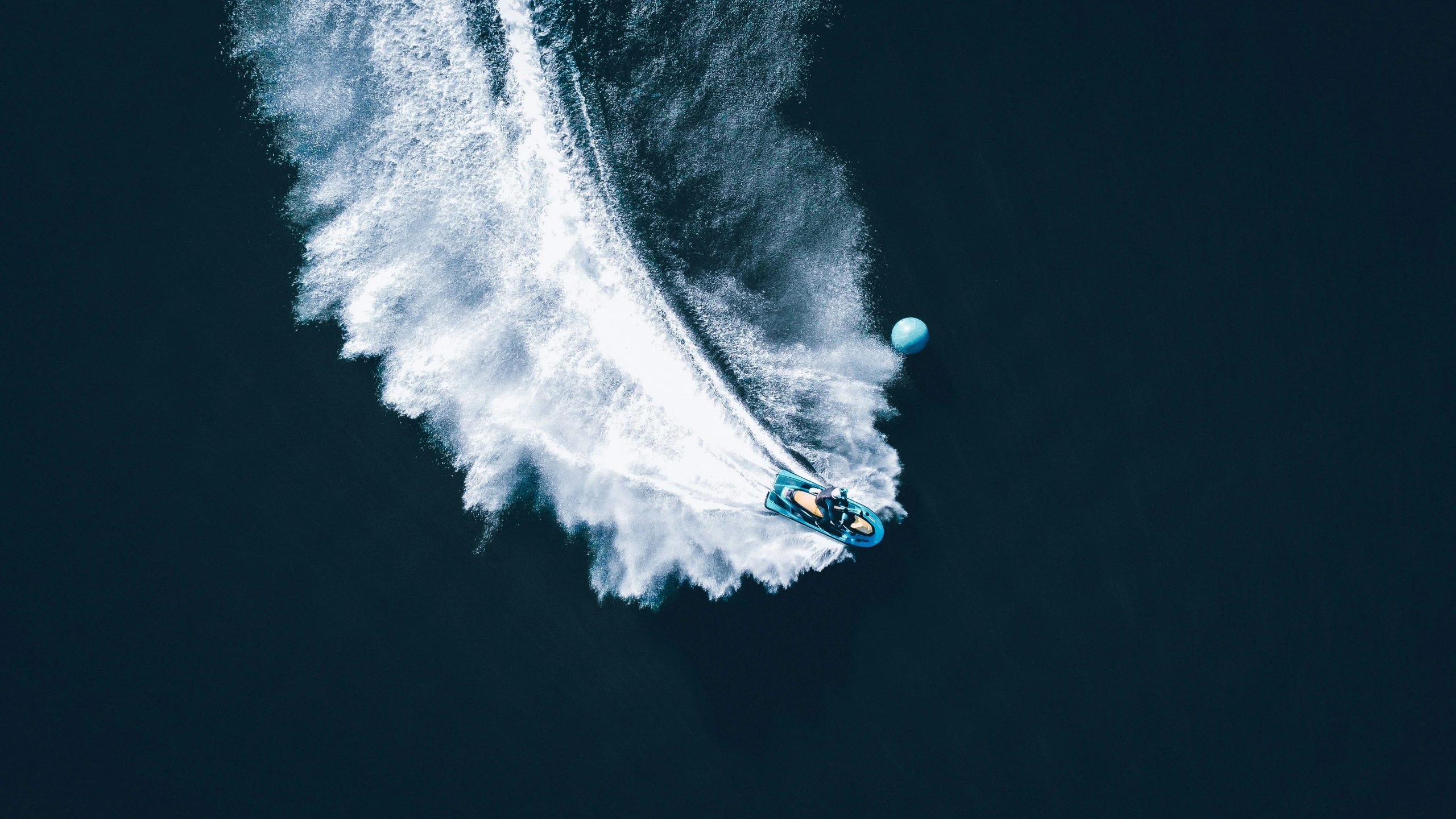 a water skier in the middle of a small ocean