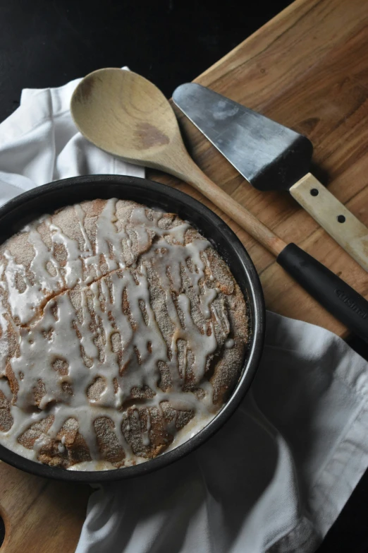 a pie that is on a wooden  board