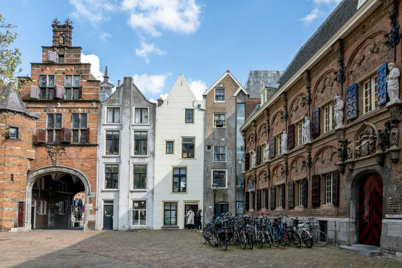 several bicycles are locked in the city street