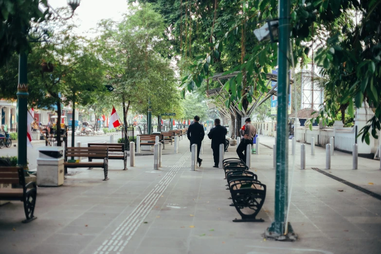 a group of people that are walking along a path