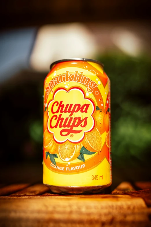 a can of chips on a wooden surface