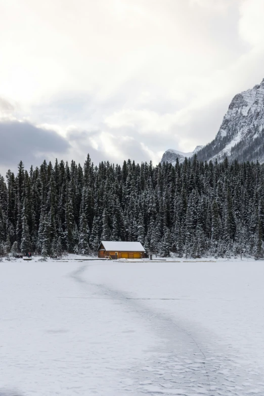 a road and building on a snowy mountain