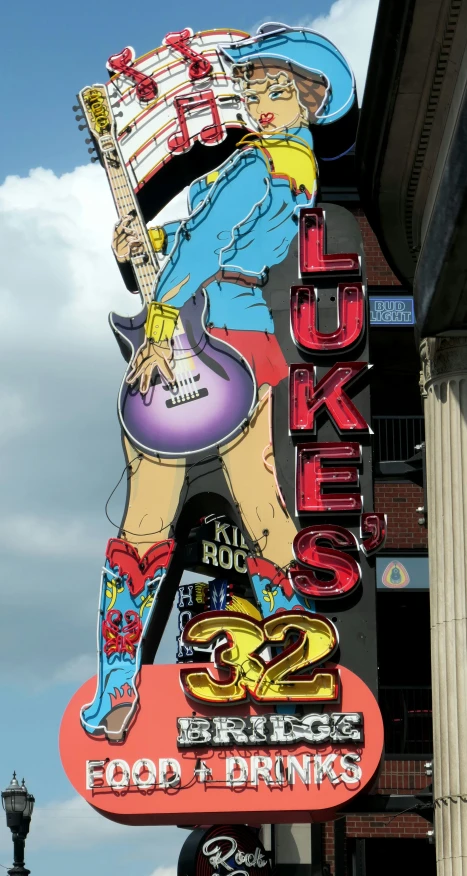a sign for the rock and roll casino hangs off of the side of a building