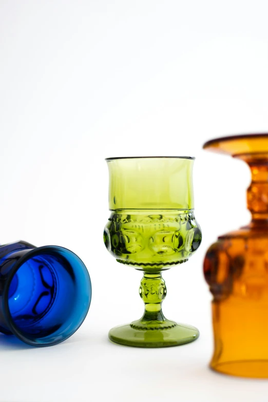 three colorful glass dishes on a white background