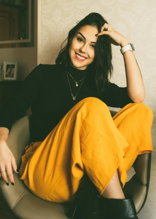 a woman in a yellow pants and black shirt