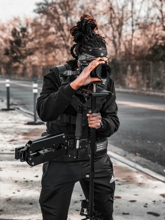 a person wearing an armor and holding a camera