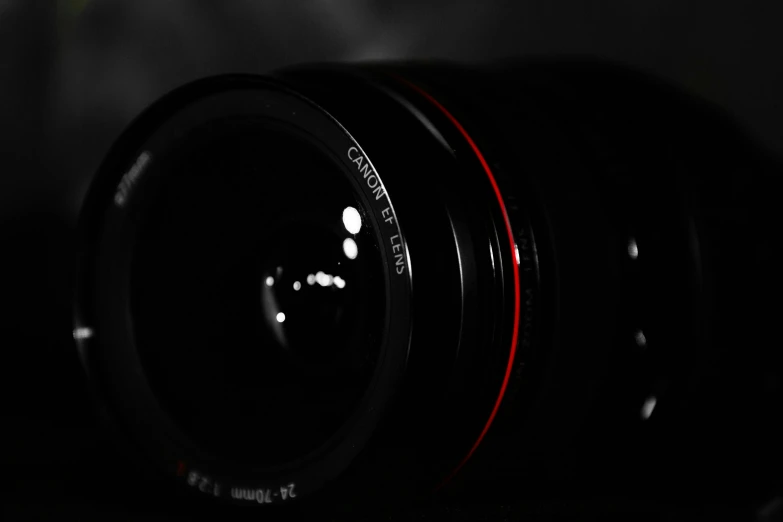 a very long lens with a black background