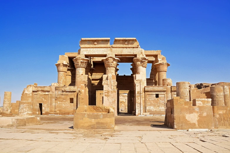 the ruins of an ancient building are covered in sand and stone