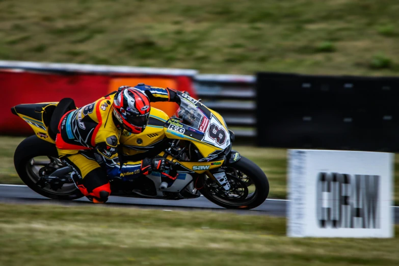 a person on a motorcycle going down the track