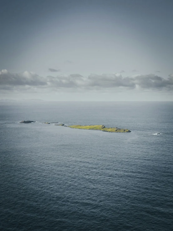 a large body of water with an island in the middle