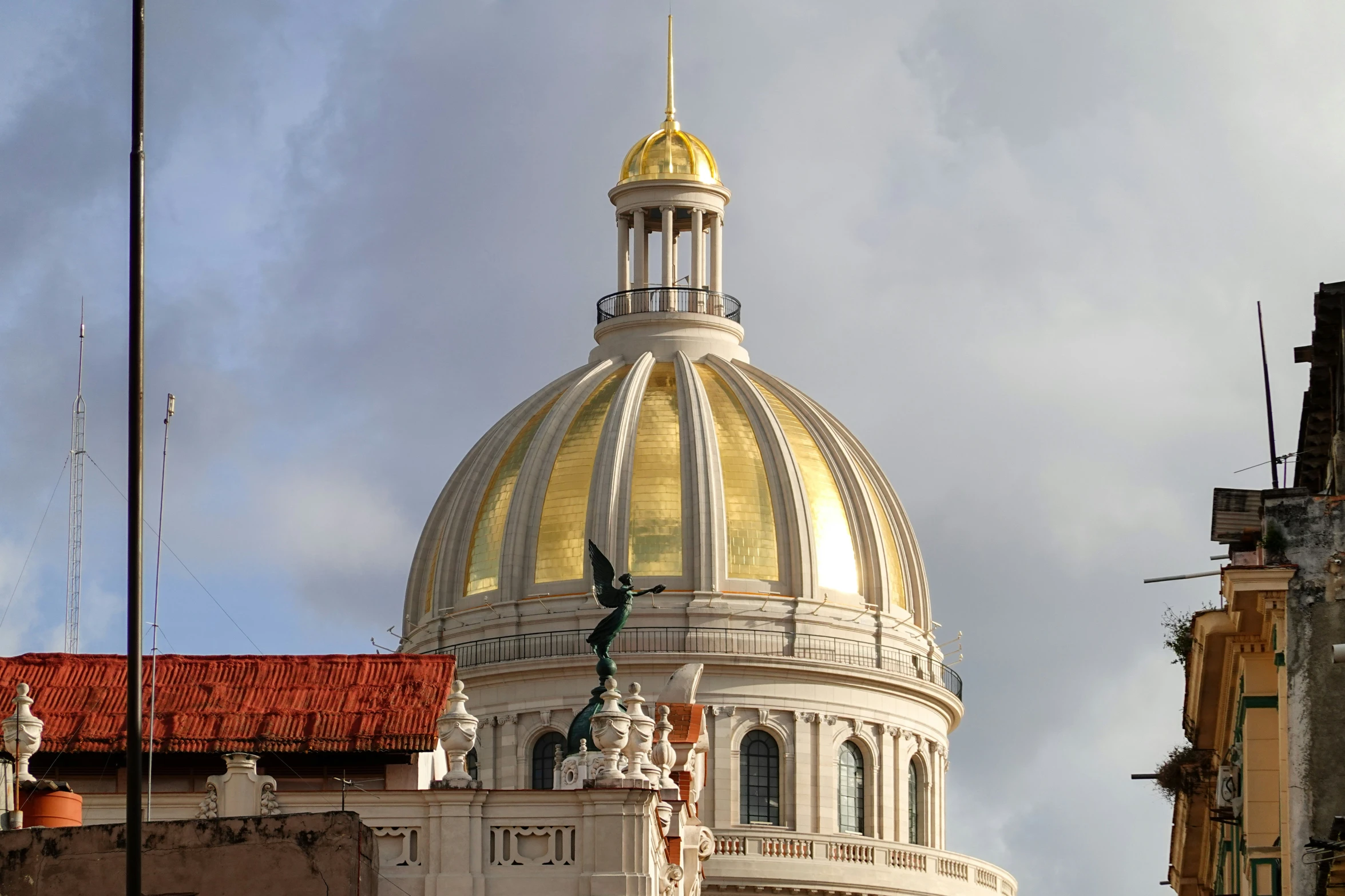 an old church with a tall yellow dome