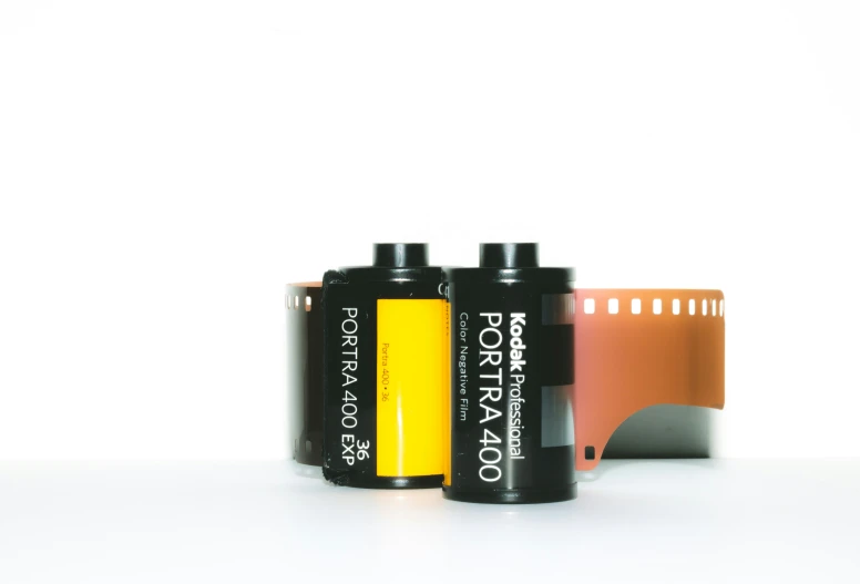 two batteries in front of an orange device