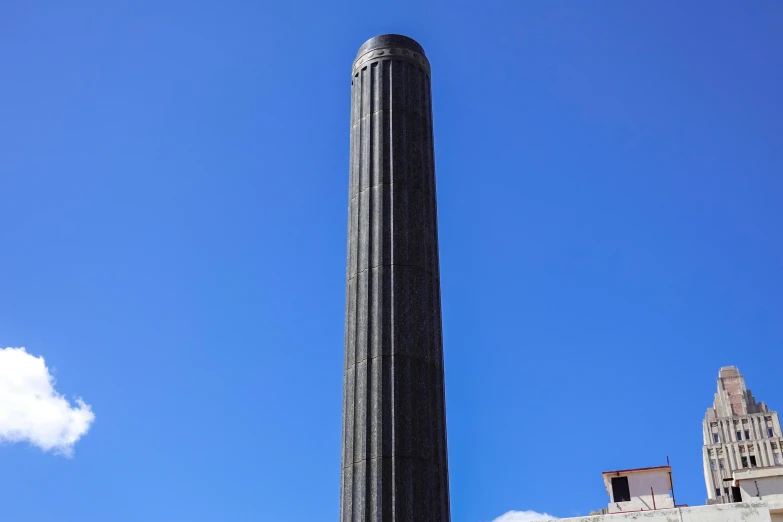 a monument sits on the side of a building