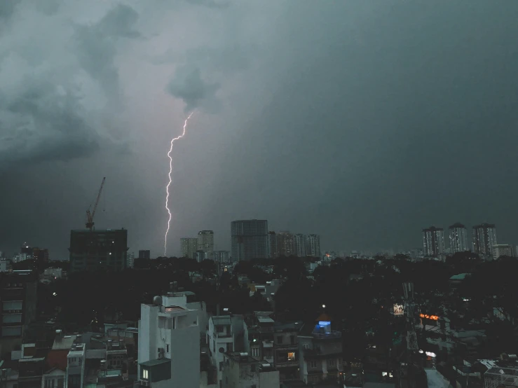 a view of some buildings and a huge storm