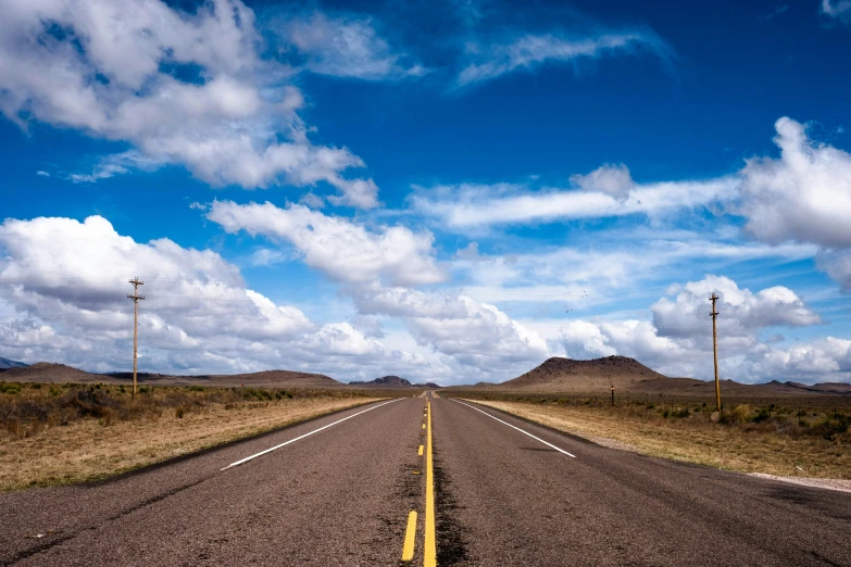 a view from the car traveling down an empty road