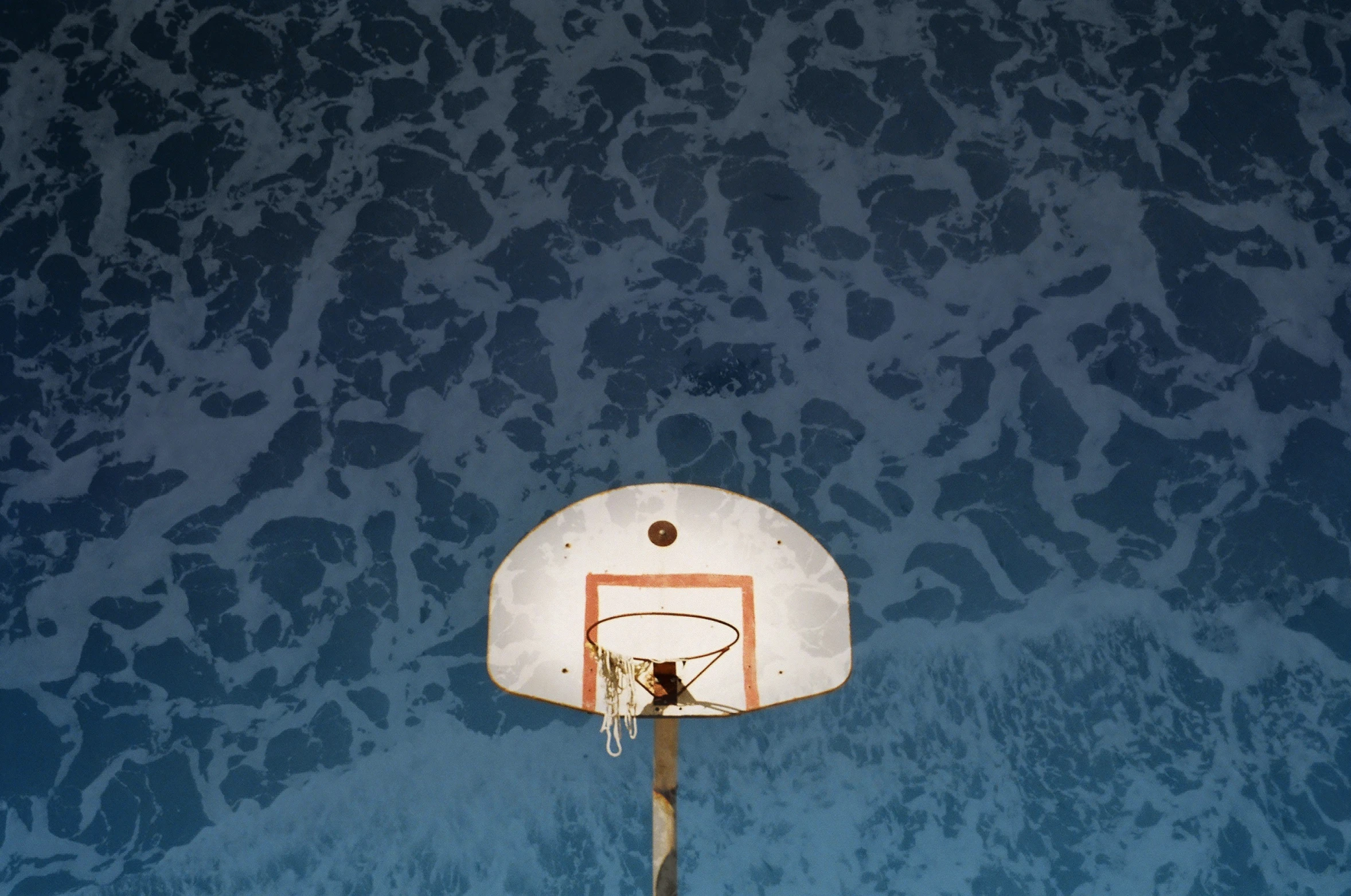 a basketball is shown from above, with the reflection of water in it