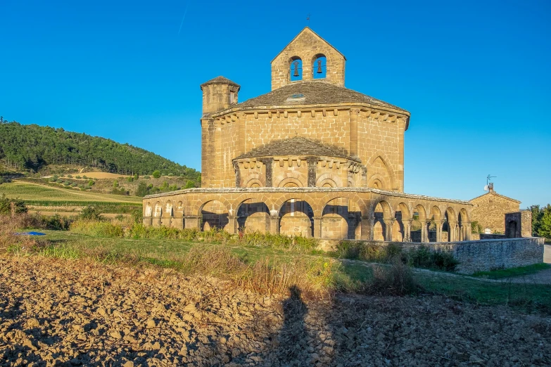 a large building is on top of a hill