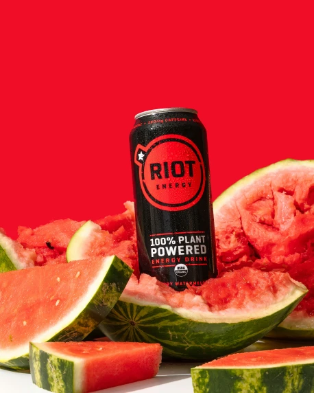a can and slices of watermelon are being displayed