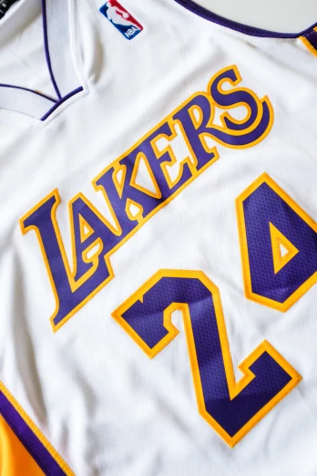 basketball jersey on the floor featuring the los lakers name and number