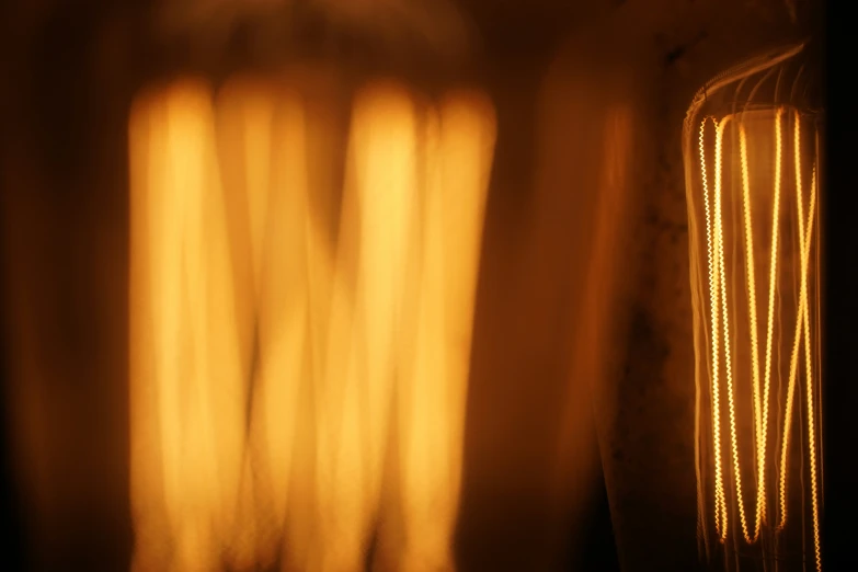 a light coming through a window showing orange color