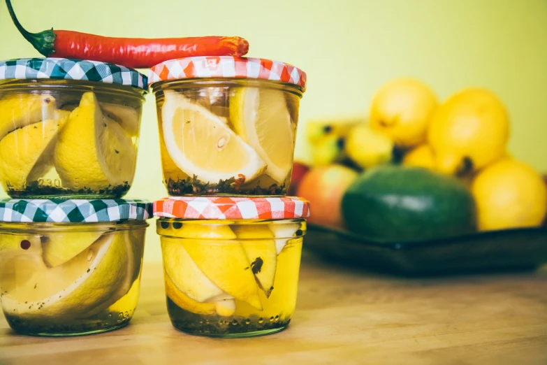 some glasses full of yellow and orange food on a table