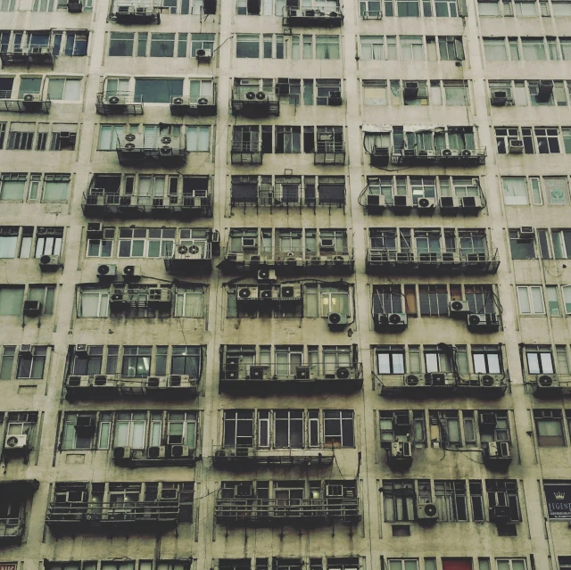 an old building with broken windows is shown