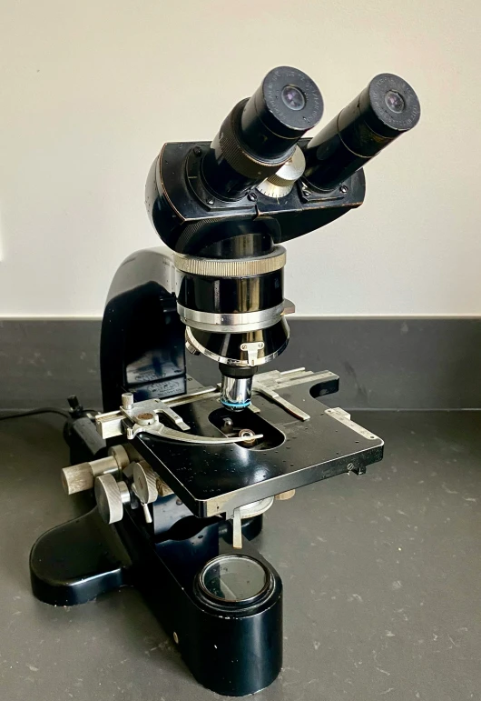 a close up of a microscope sitting on a table