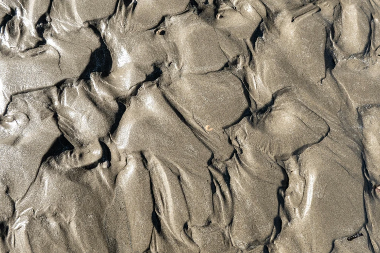 closeup of an up close sand pattern from the ground