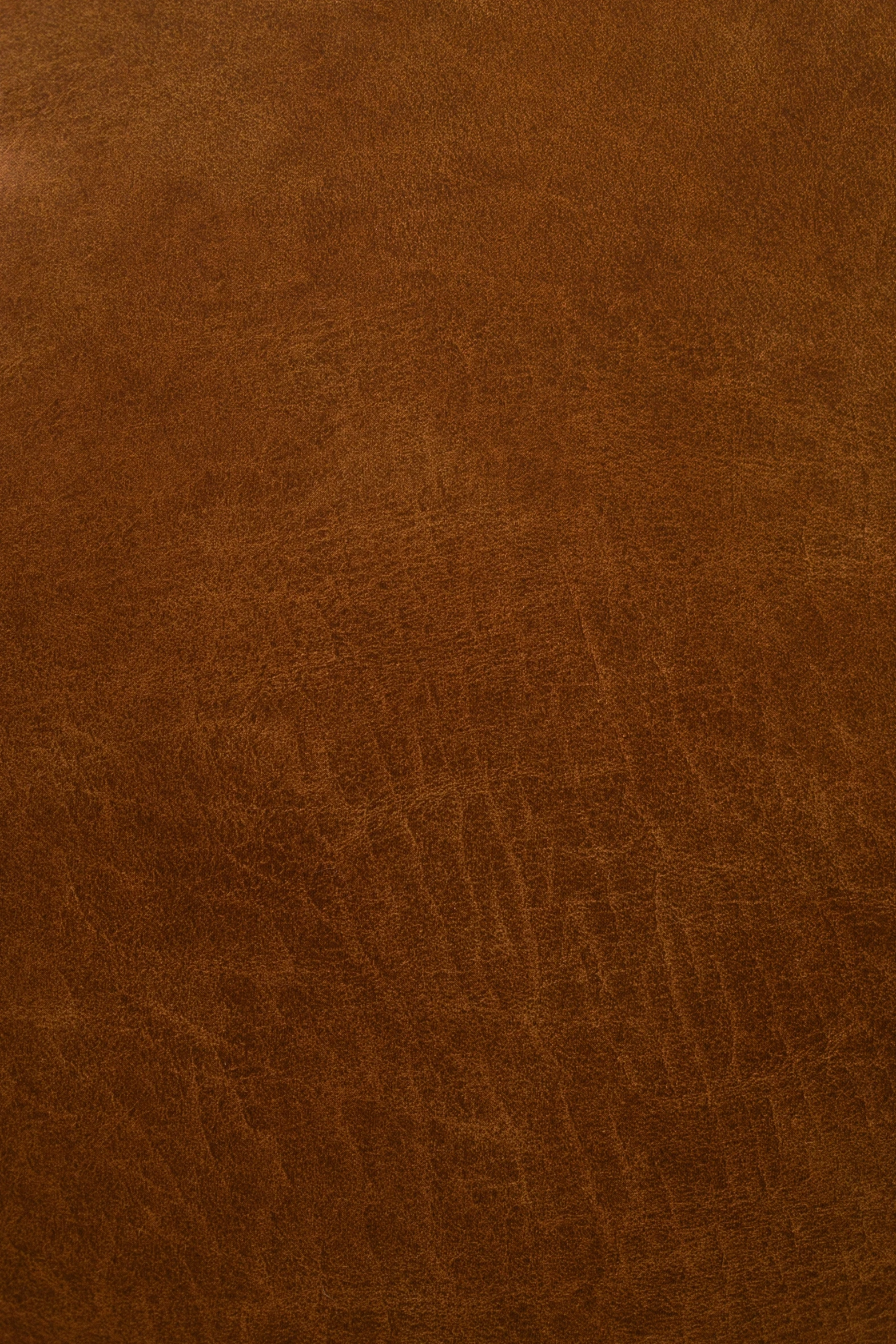 a black clock on top of a brown carpet