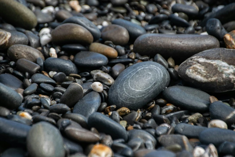 a circle shaped rock on a pile of rocks