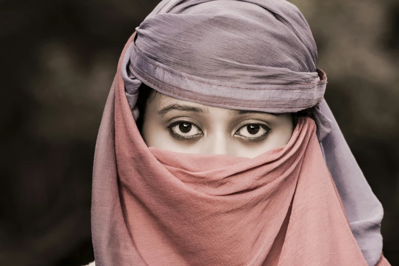 an old fashioned po of a woman wearing a pink scarf