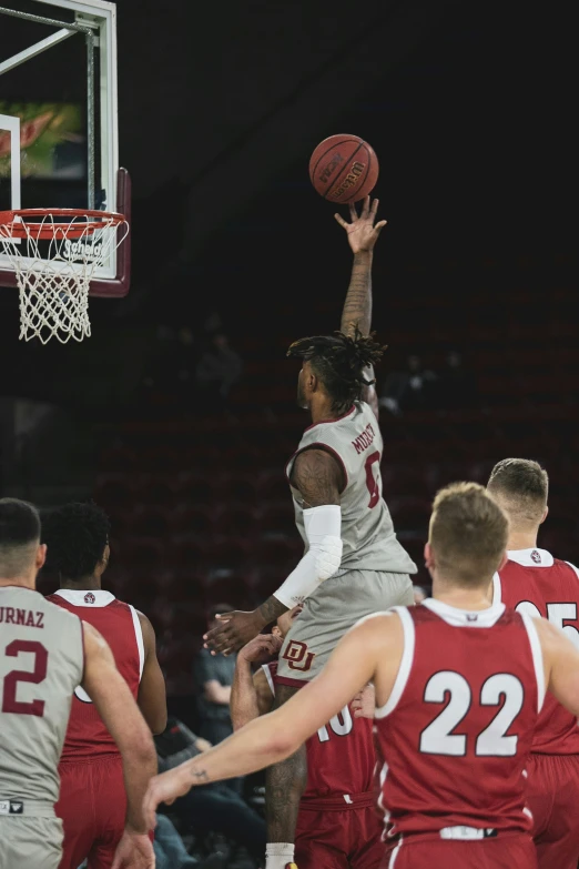 a man in the air with a basketball