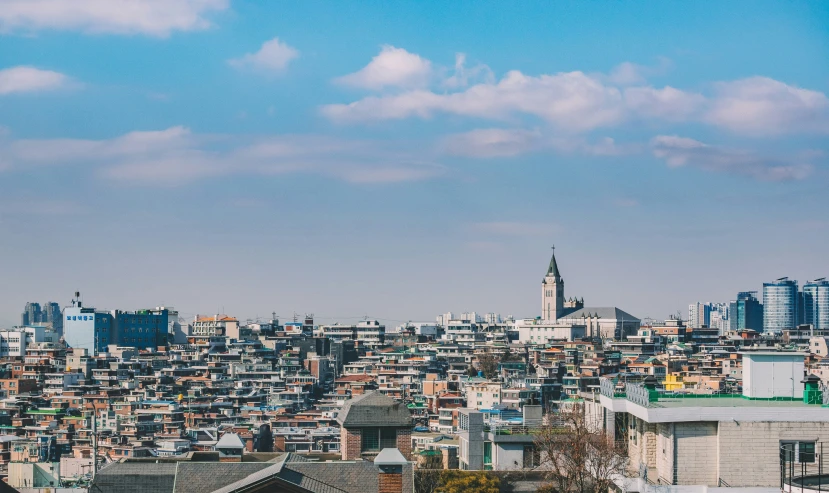 a city skyline with a very tall tower