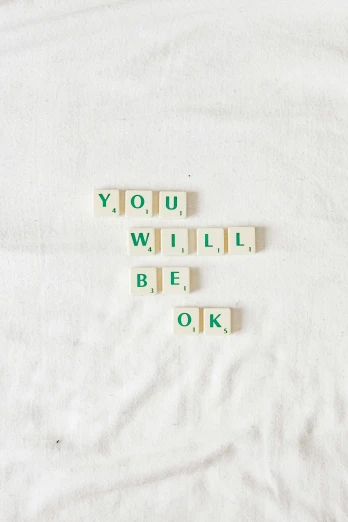 scrabble tiles spelling you, will, be, ok in words