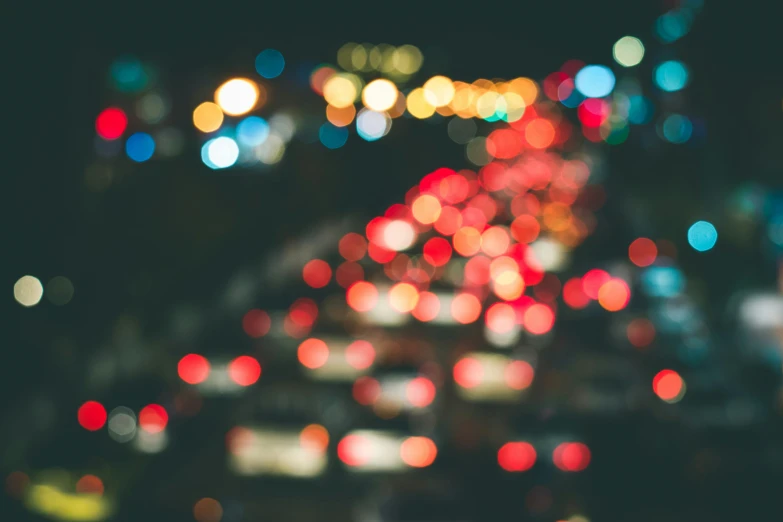 a street filled with lots of light at night