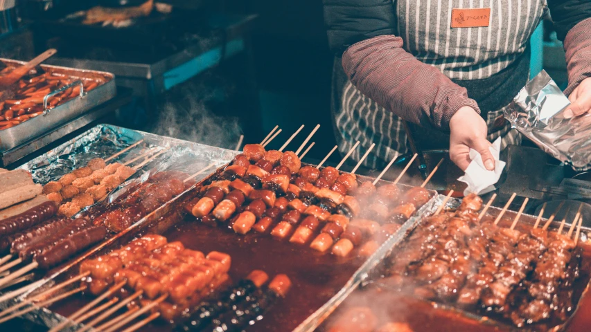 some skewers of food on a stick being served