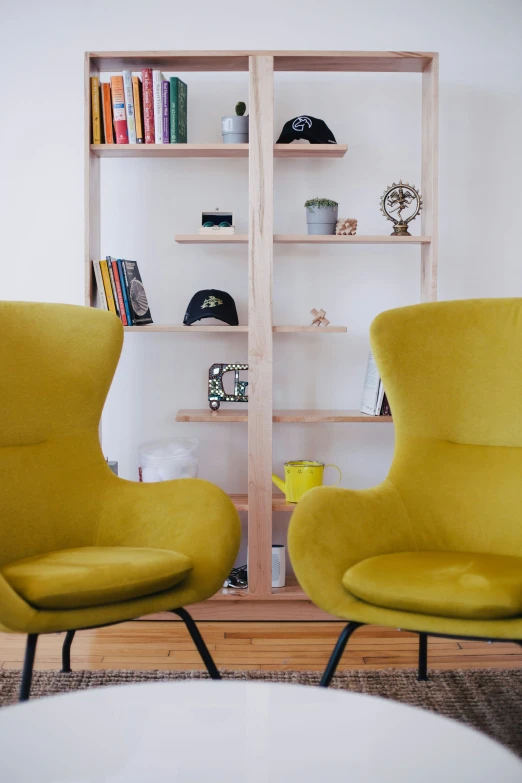 a couple of yellow chairs sit next to each other