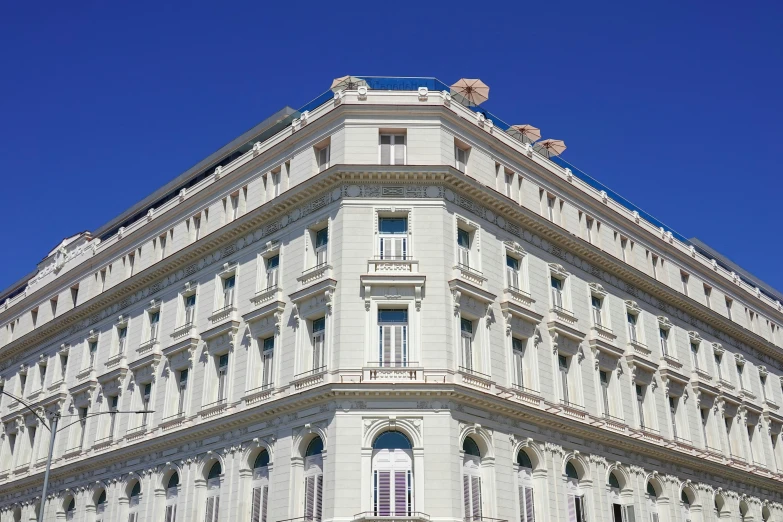 a building with some windows and balconies on the top