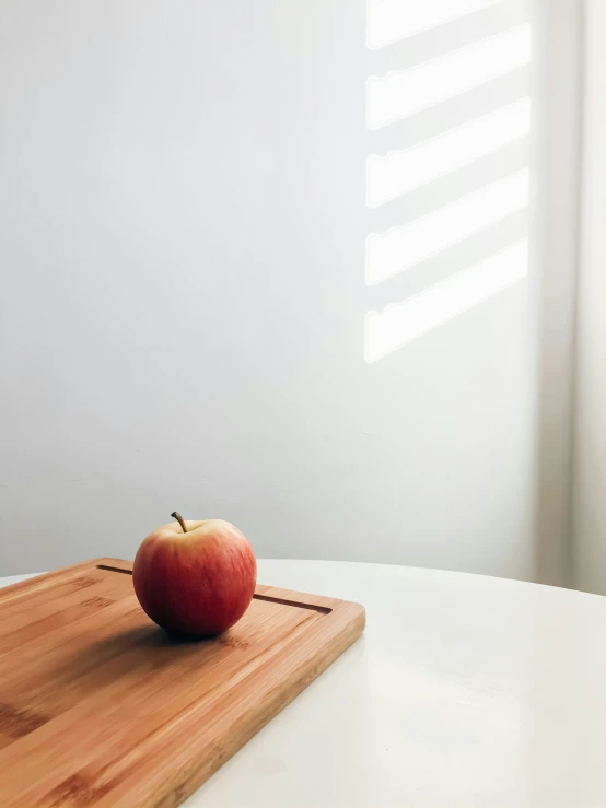 an apple on a  board, ready to be used as a gadget