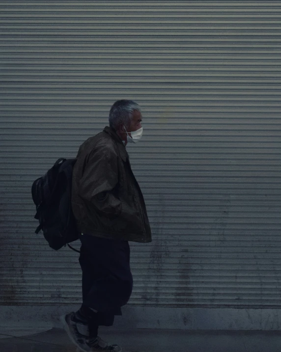 a person with a mask walks down the street