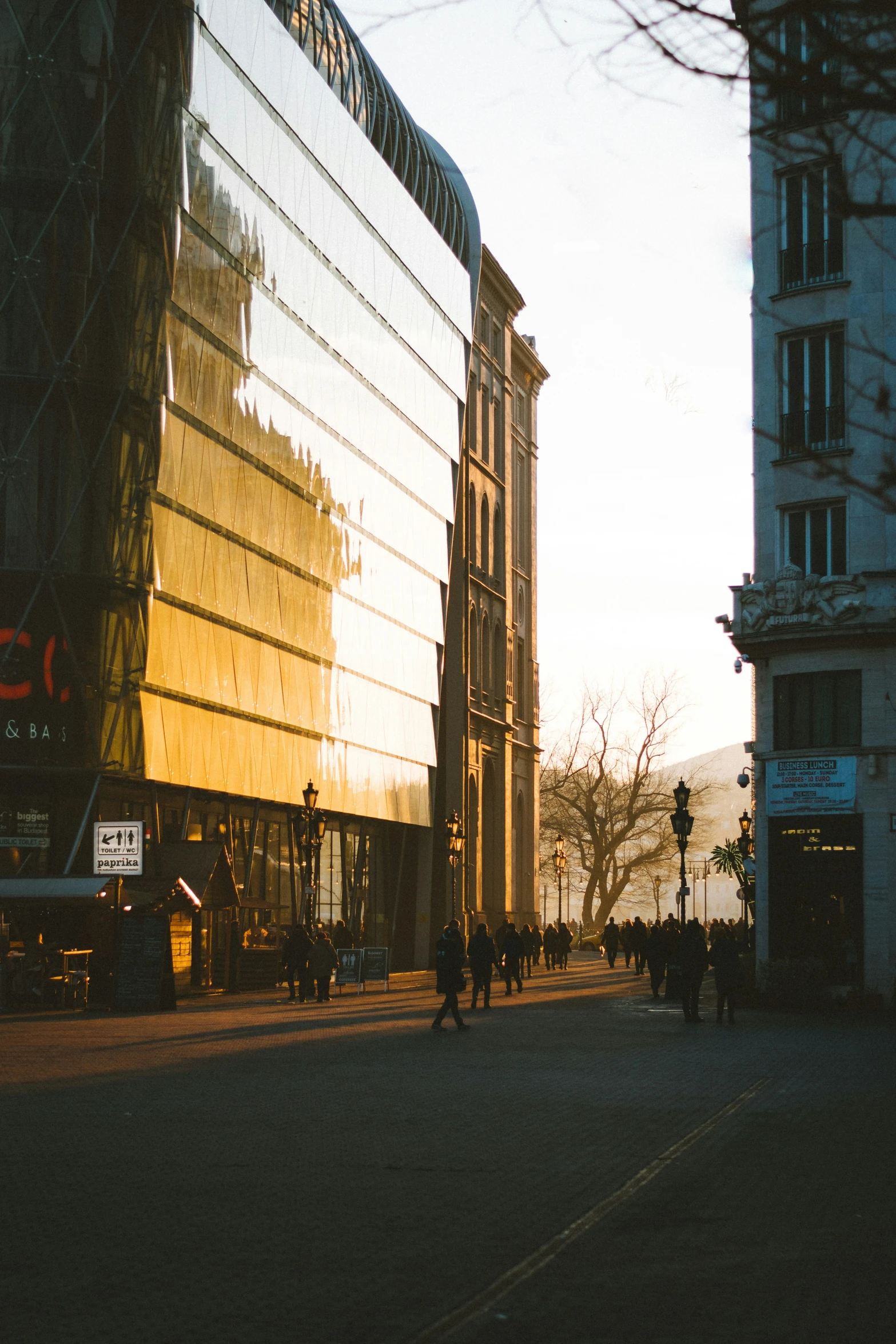 people walking around outside on a city street