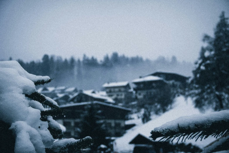 snow falling on a residential area and the snow is melting down