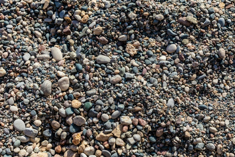 small rocks and gravel mixed together in the ground