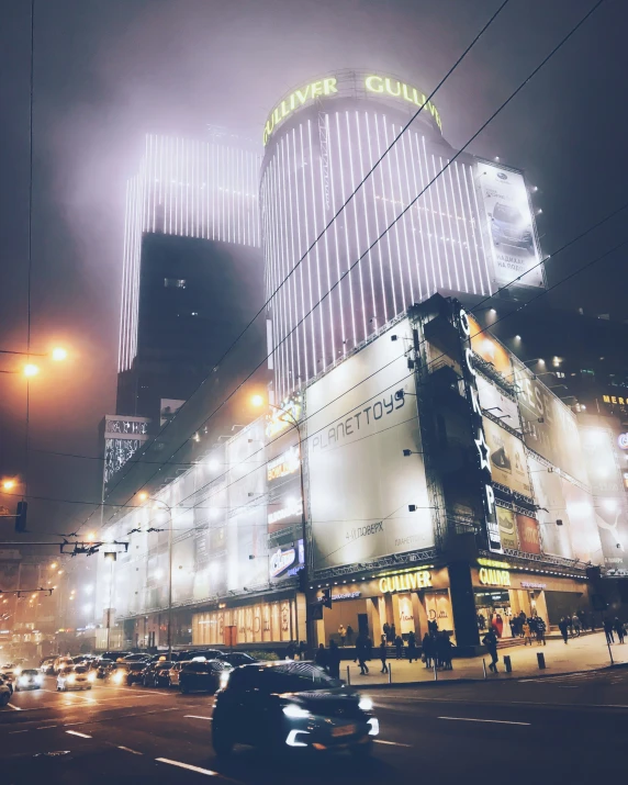 the busy street of a large city at night