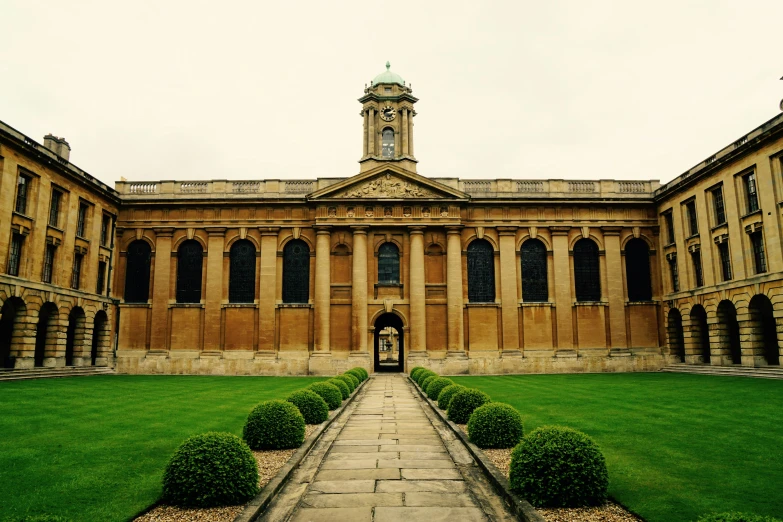 there is a large brown building with a clock tower