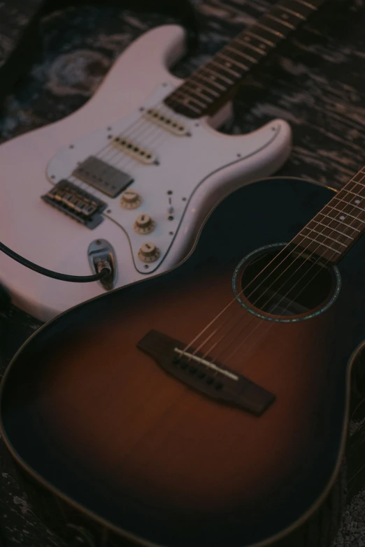 a closeup view of two guitars on a cloth