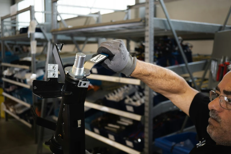 an image of a man working with tools in the factory